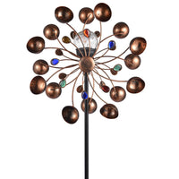 Zonne-energie aangedreven windspinner in glazen bol