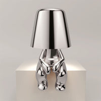 Metalen tafellamp met reflectieve artistieke vorm