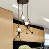LuxeLumin Little Man Chandelier | Betoverende hanglamp in de vorm van een pop voor kinderkamers en keukeninrichting, met zachte verlichting en een leuk ontwerp.