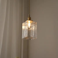 Vintage glazen hanglampen met een afwerking in messing