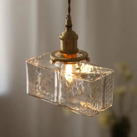 Vintage glazen hanglampen met een afwerking in messing