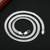 AuraElegance Sterling Zilveren Ketting | Tijdloos 925 sterling zilveren ontwerp met een 6mm zijketting, beschikbaar in 16/18/20/22/24 inch, perfect voor bruiloften, verlovingen en luxe cadeaus.