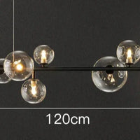 Moderne lineaire kroonluchter – glazen bollen en verlichte ring op zwart frame
