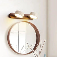 Moderne LED wandlamp met draaibare lampenkappen van steen en houten basis