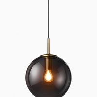 Wandlamp met hangende glazen bol