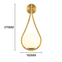 Design wandlamp met gouden LED en witte glazen bol Shadow