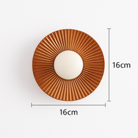 Moderne LED wandlamp in de vorm van een metalen zon Hasna