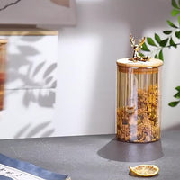 Elowen Stag Amber Afwerking Glazen Potten Set Van Drie Met Gouden Deksel