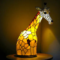 Artistieke plafondlamp met dierenmotief in glas