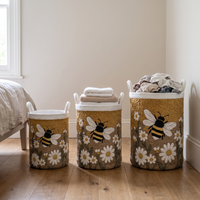 Vadderad wasmand met madeliefjes en bij, met handvatten van canvas, staat zelfstandig