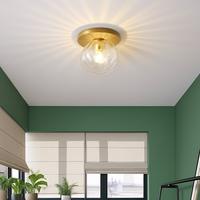 Design LED plafondlamp rond goudkleurig met glazen bol Porch