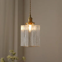 Vintage glazen hanglampen met een afwerking in messing