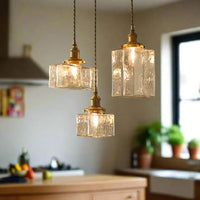 Vintage glazen hanglampen met een afwerking in messing